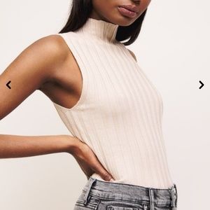 Sleeveless mock neck top